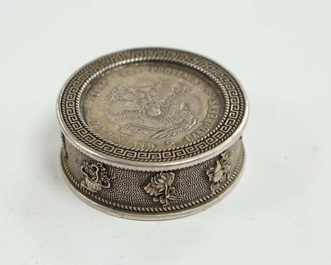 A Chinese white metal coin box and stamps, coin box 5cm diameter. Condition - coin box interior marked, stamps appear fair